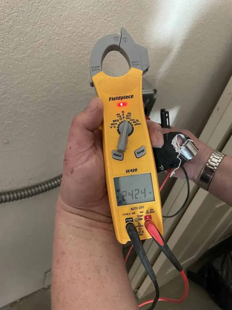Voltage testing with clamp meter during Outlet Installation in Carrollton